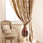 beige curtains with tassels