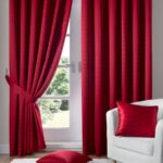 burgundy curtains on the window