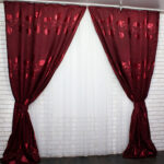 burgundy curtains with a pattern