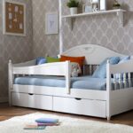 white baby bed with bumpers