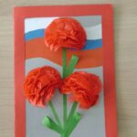 three carnations on a postcard