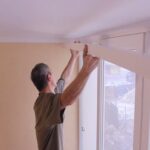 installation of the cornice to the ceiling