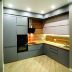 kitchen cabinets up to the ceiling with cornice