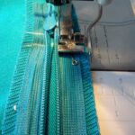 sewing the zipper to the blanket