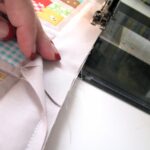 sewing a blanket on a typewriter