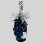 bottle with bow and grapes