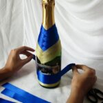 the process of decorating the bottle with tape