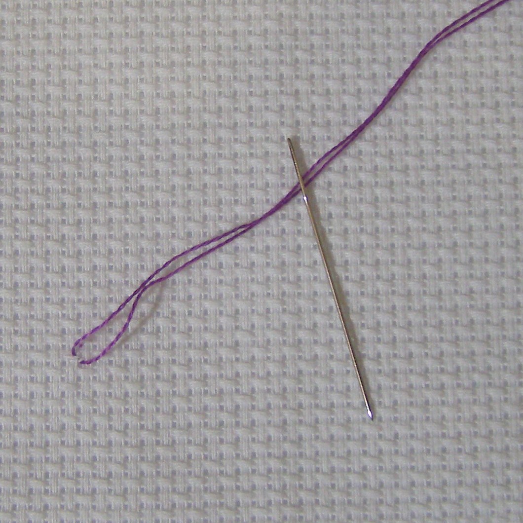 loops of thread with a needle