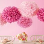 napkin pom poms on the ceiling pink