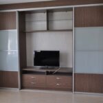 wardrobe in the living room with TV