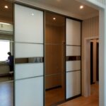 wardrobe in the living room with mirror inserts