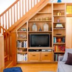 cabinet under the stairs with tv