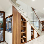 cabinet under the stairs with shelves