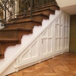 white wardrobe under the stairs with doors