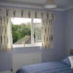 curtains to the window sill in the bedroom decor photo