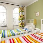 curtains to the window sill in the bedroom design ideas