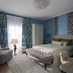 curtains in the bedroom with blue wallpaper