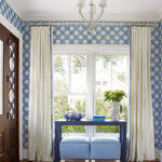 white curtains on blue wallpaper