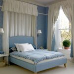 beige curtains in the bedroom with blue wallpaper