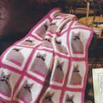 plaid en tricot tunisien avec des chats