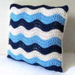 pillow on knitting needles striped