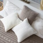 pillow on knitting needles white