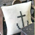 pillow on knitting needles with anchor