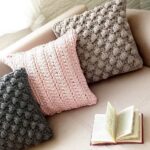 pillow on knitting needles