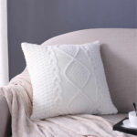 pillow on knitting needles white with rhombus