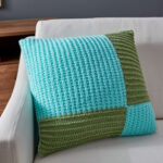 pillow on knitting needles blue square