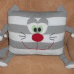 pillow on knitting needles cat striped