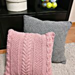 pillow on knitting needles pink