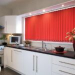 the blinds are red in the kitchen