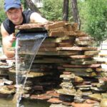 decorative waterfall with a guy