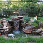 decorative waterfall with statue