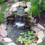 decorative waterfall with a pond