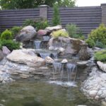 decorative waterfall at the fence