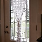 curtains made of beads on the door window