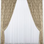 curtains in the living room beige with a pattern