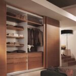 wooden wardrobe with clothes