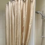 beige curtain in the bathroom