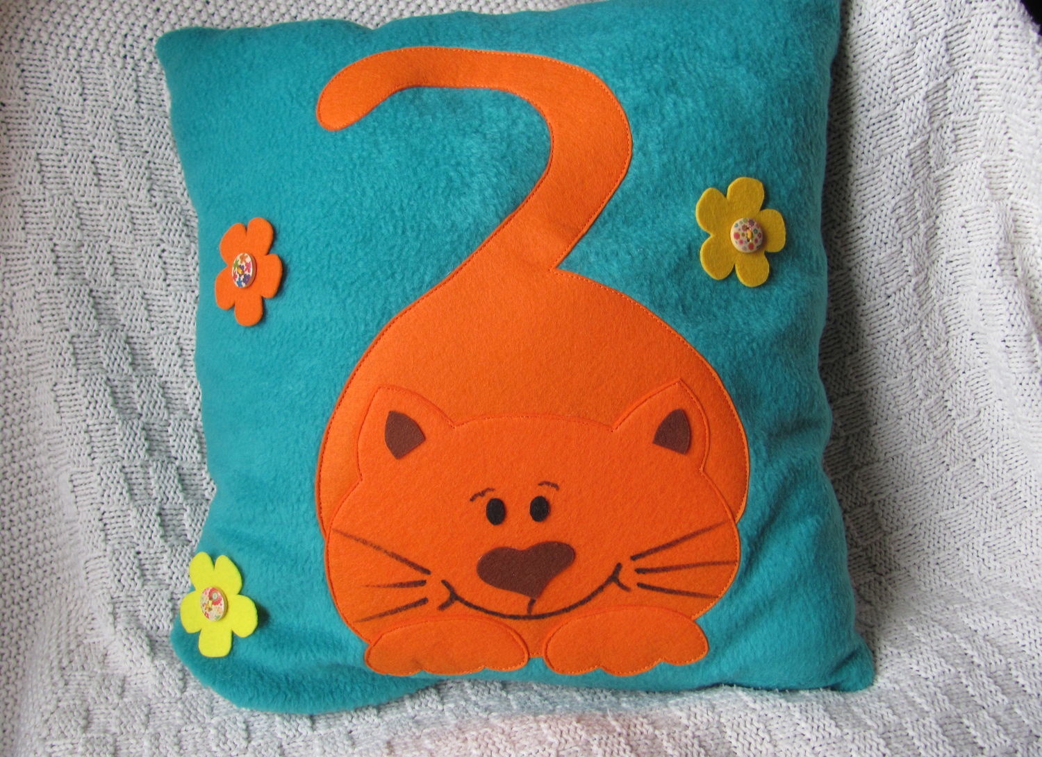 orange cat on the fabric